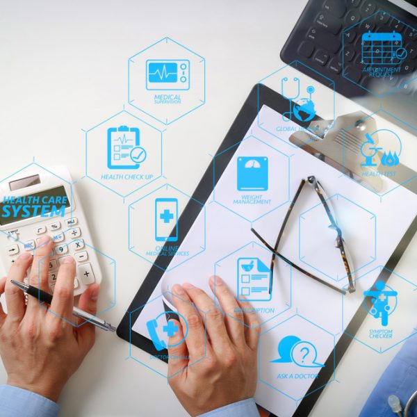 Health care system diagram with health check and symptom on VR dashboard.Healthcare costs and fees concept.Hand of smart doctor used a calculator for medical costs in modern hospital