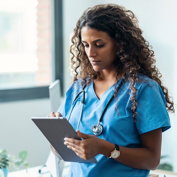 medical-staff-reading-tablet-in-office-1451854647-1200-776