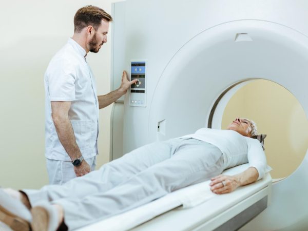 medical-technician-mature-patient-during-mri-scanning-procedure-clinic