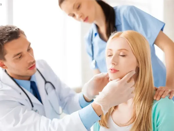 woman-getting-face-examined-by-doctor